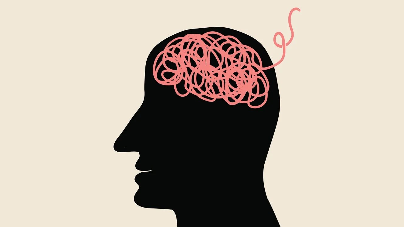 Illustration of a silhouette of a head with pink scribbles in the shape of a brain