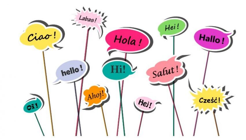 A graphic illustration of several multicolored speech bubbles with the word "hello" inside of them in different languages
