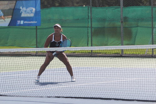 Student athlete playing tennis 