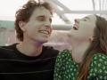 A still from the film 'Dear Evan Hansen' of two people laughing while on a ferris wheel ride
