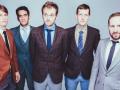 The five members of 'Punch Brothers' posing in suits and ties 