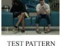 The 'Test Pattern' film poster featuring two people sitting indoors on a blue seat with paintings in the background