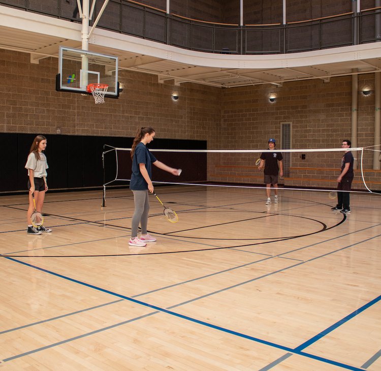 Students playing Badminton inside the Campus Recreation Center