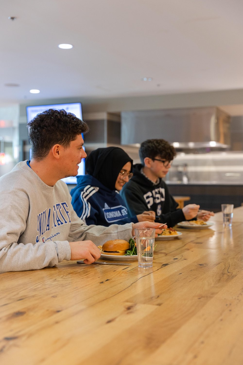 Students eating together at The Kitchens