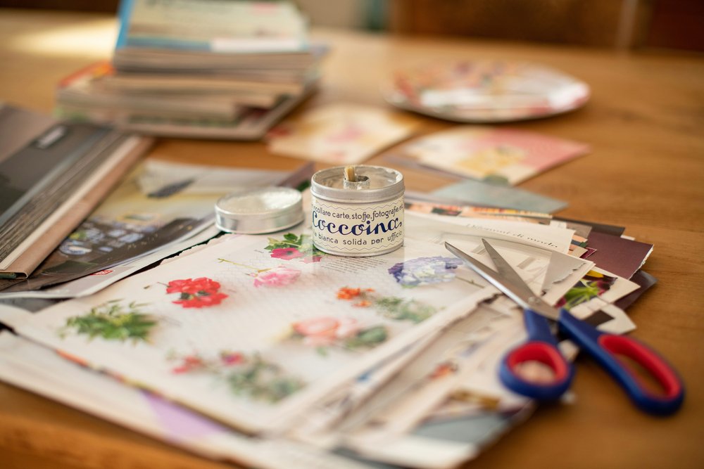 Scrapbooking materials on a table surface