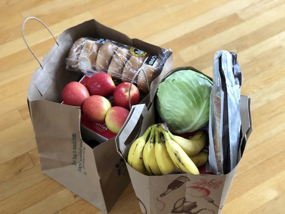 Paper bags filled with grocery items