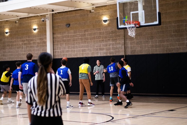 A group of people playing indoor sports