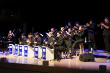 A group of people performing in a Jazz Band recital