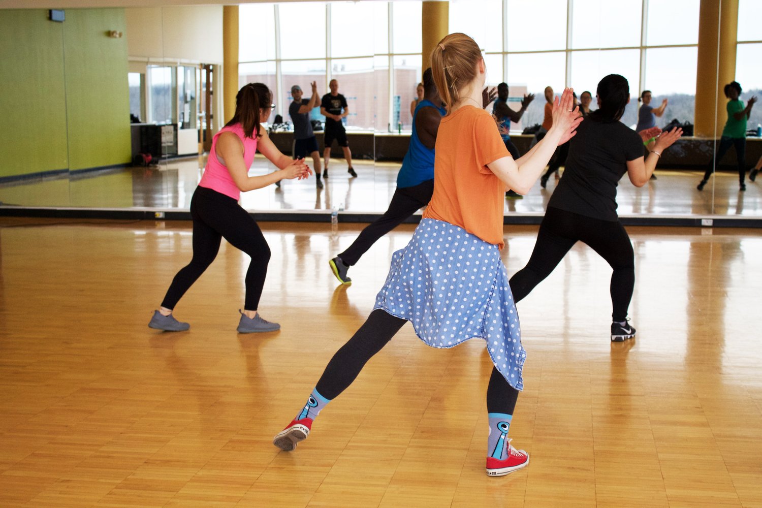 A group of people participating in a jazzercise class