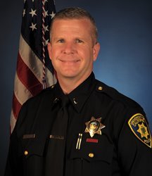 Portrait of Kevin Kilgore smiling while in uniform