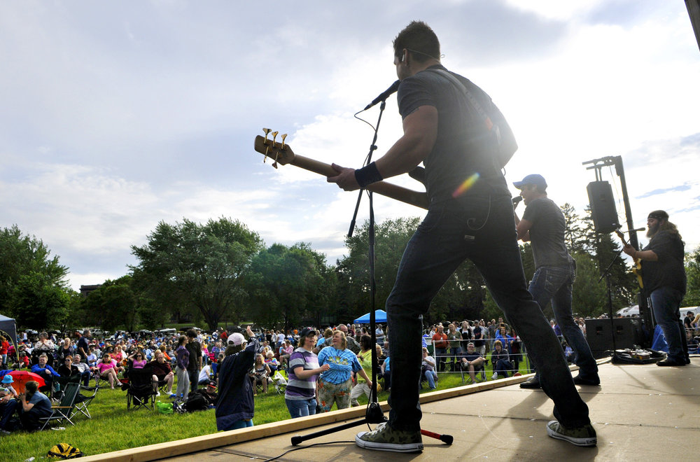 A band performing live music on an outdoor stage