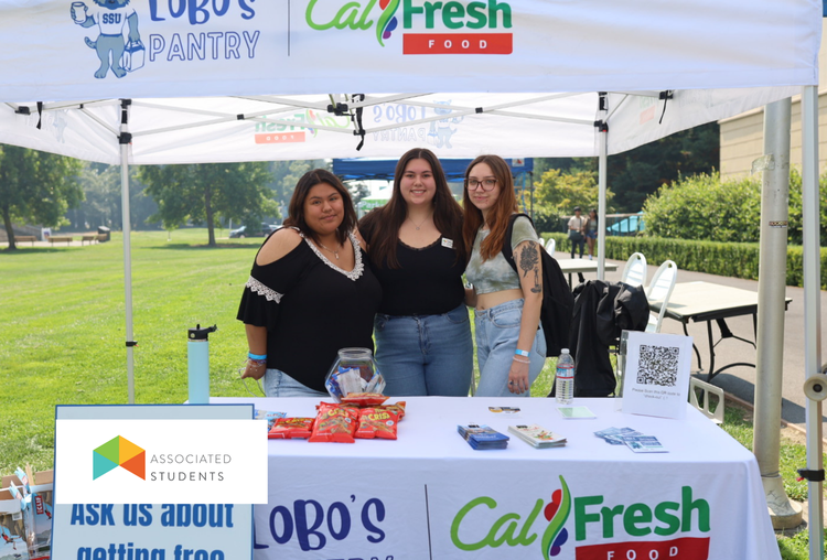 Students posing while tabling for Lobo's Pantry