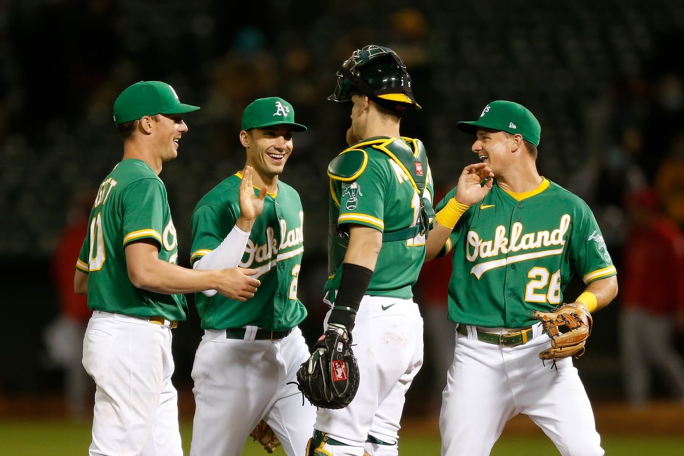 Oakland Athletics players high-fiving