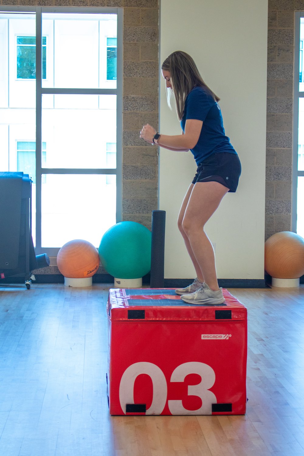 A student using exercise equipment in the Campus Recreation building