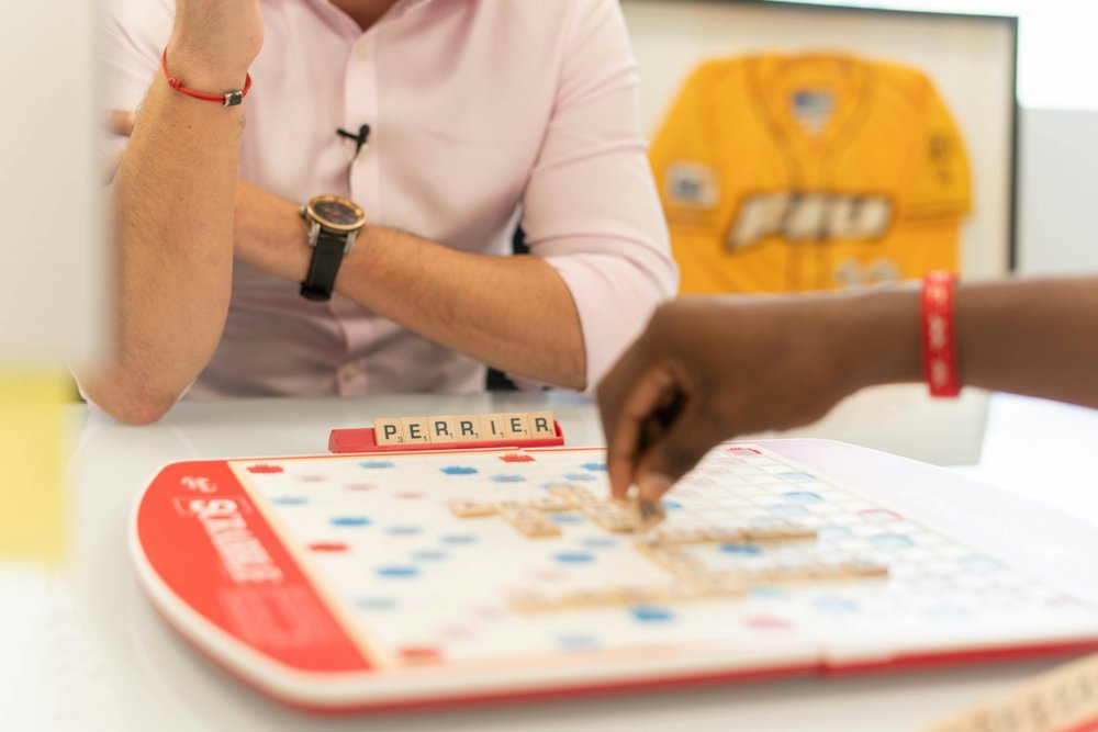 Two people playing the board game Scrabble