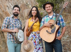 Sonia De Los Santos and The Okee Dokee Brothers smiling and posing with their instruments