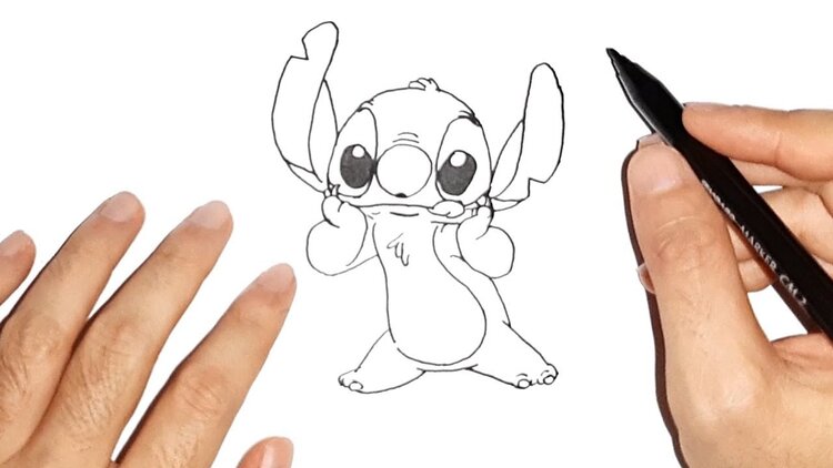 Two hands drawing the Disney character Stitch
