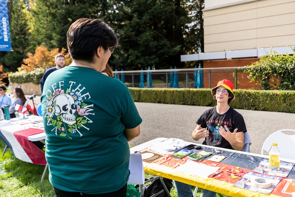 Students talking during an outdoor tabling fair