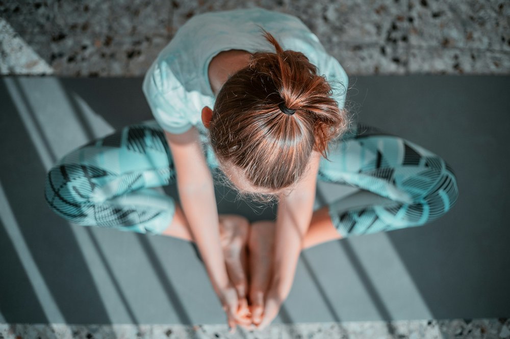 Sonoma sitting in a yoga pose