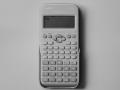 A black and white image of a T9 calculator 
