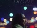 Movie poster for Ghost Tropic featuring the profile of a person dressed warmly at night with colorful lights in the background