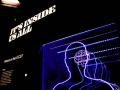 A museum display of brain activity featuring an outline of a person and their brain using purple lights and the words "It's Inside Us All"