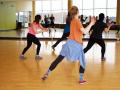 A group of people participating in a jazzercise class