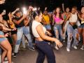 A crowd of students dancing at a celebration 