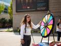 person spinning prize wheel