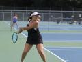 Student athlete playing tennis 